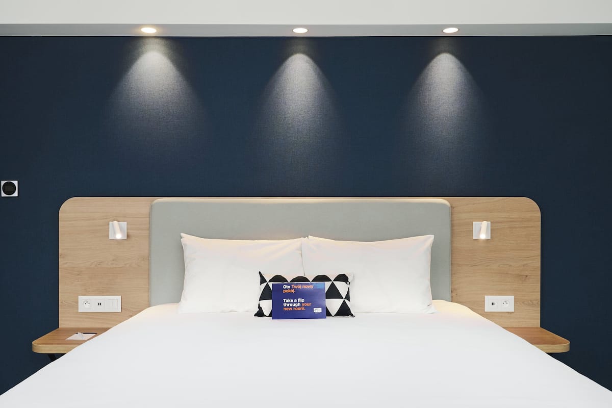 Premium bedding, desk, laptop workspace, blackout drapes