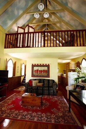 The Abbey Cottage | Living area | Flat-screen TV, fireplace, DVD player, MP3 dock - Lisson Grove Boutique Resort & Day Spa (Tamborine Mountain)