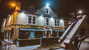A historic building with a sign reading "Commercial Hotel." - The Commercial Hotel (Wishaw)