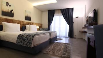 Habitación doble ejecutiva | Sábanas italianas Frette, ropa de cama de alta calidad y edredón 