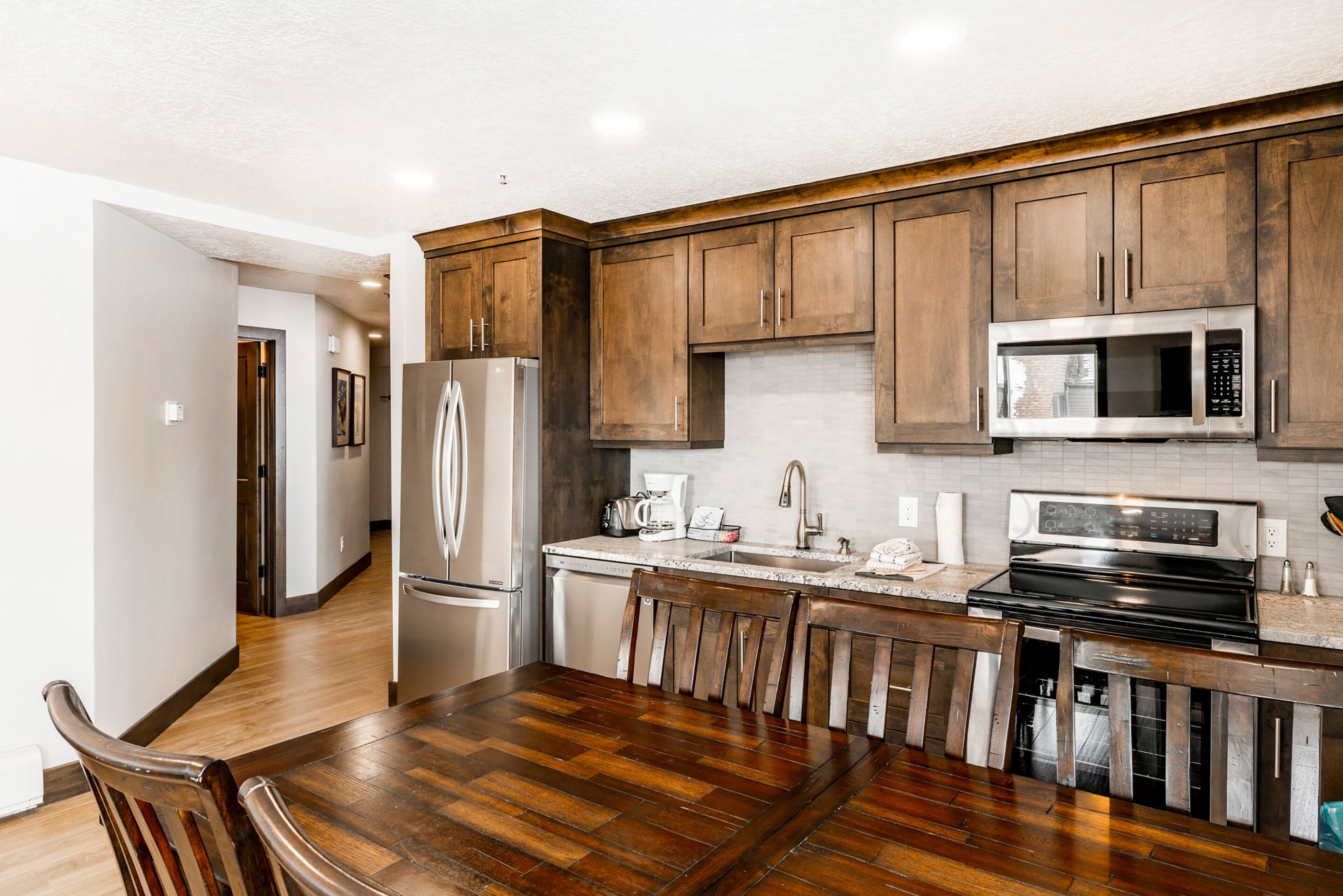 2-Bedroom Condominium #22 | Private kitchen | Full-size fridge, microwave, stovetop, dishwasher