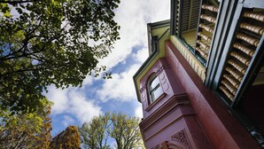 A building with a clock tower, a window, and a balcony. - Leura House (Leura)