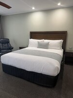 Deluxe King Room | Premium bedding, down comforters, pillowtop beds, blackout drapes