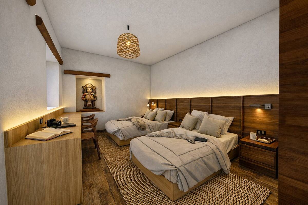 A modern bedroom with two beds, a desk, and a hanging light fixture.