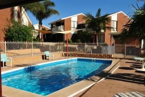 Outdoor pool, open 8:00 AM to 8:00 PM, sun loungers