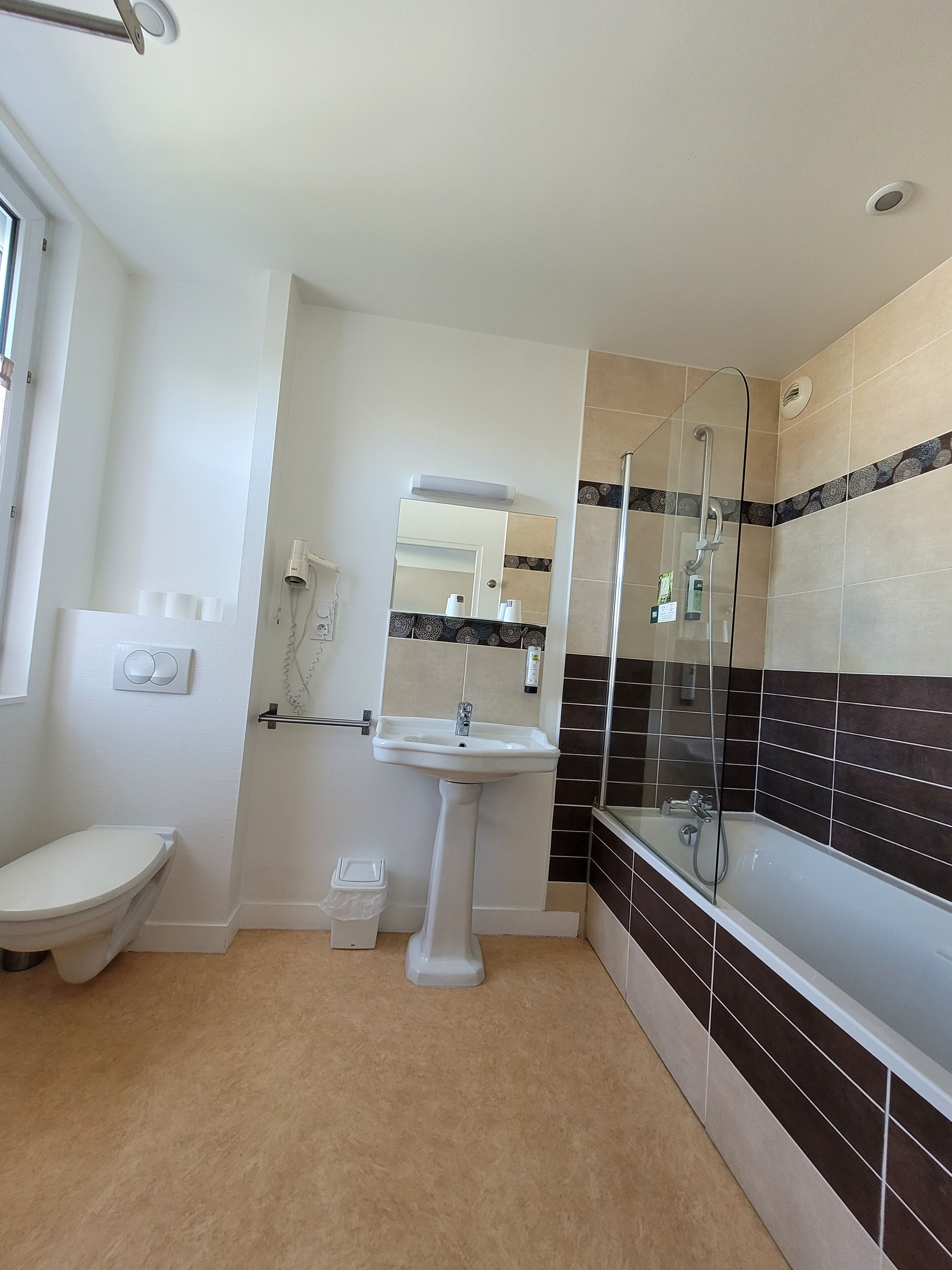 suite, bathtub | bathroom | shower, hair dryer, towels, soap