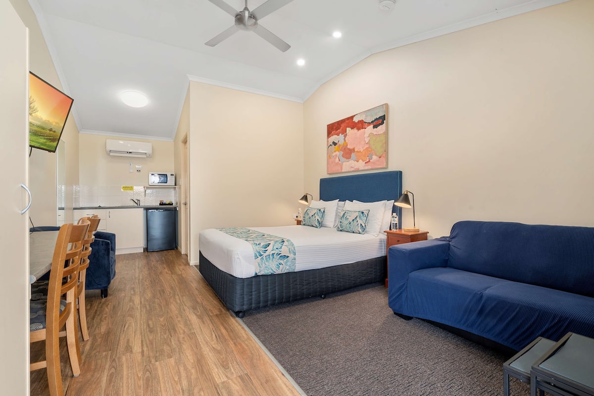 premium bedding, pillow-top beds, laptop workspace, blackout curtains