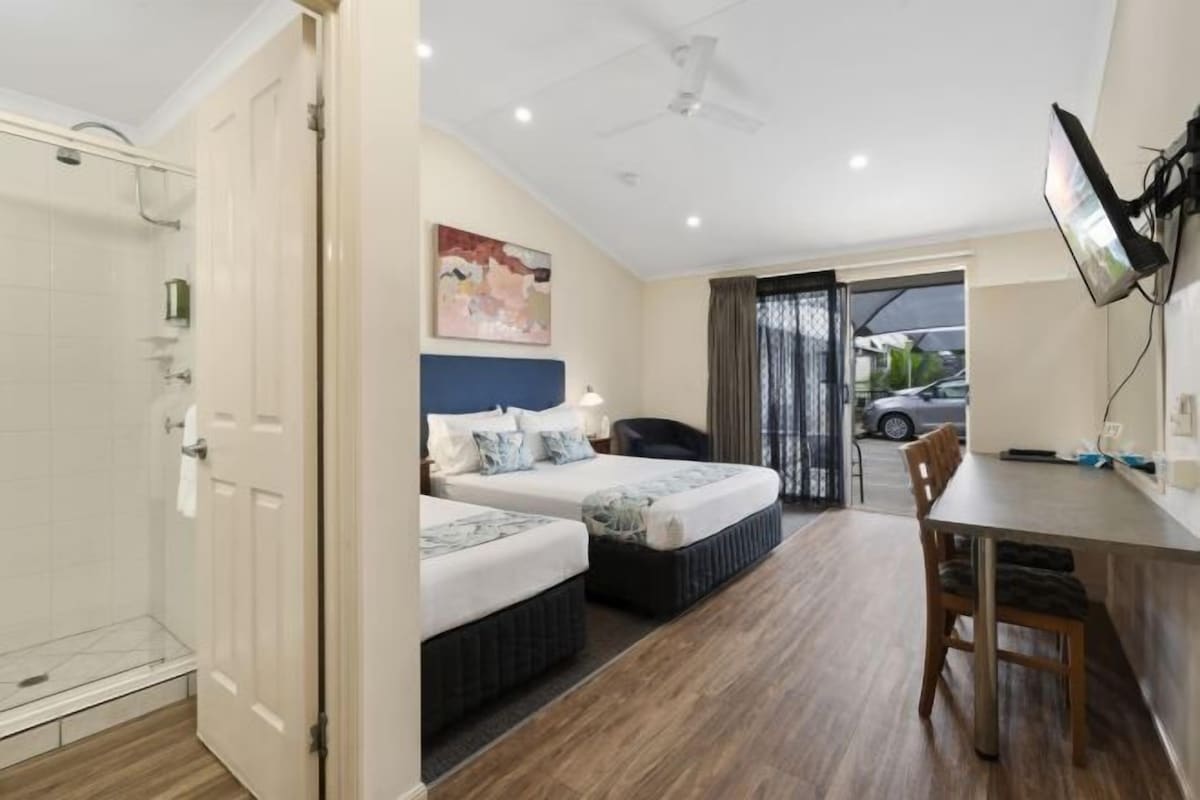 Premium bedding, pillow-top beds, laptop workspace, blackout curtains