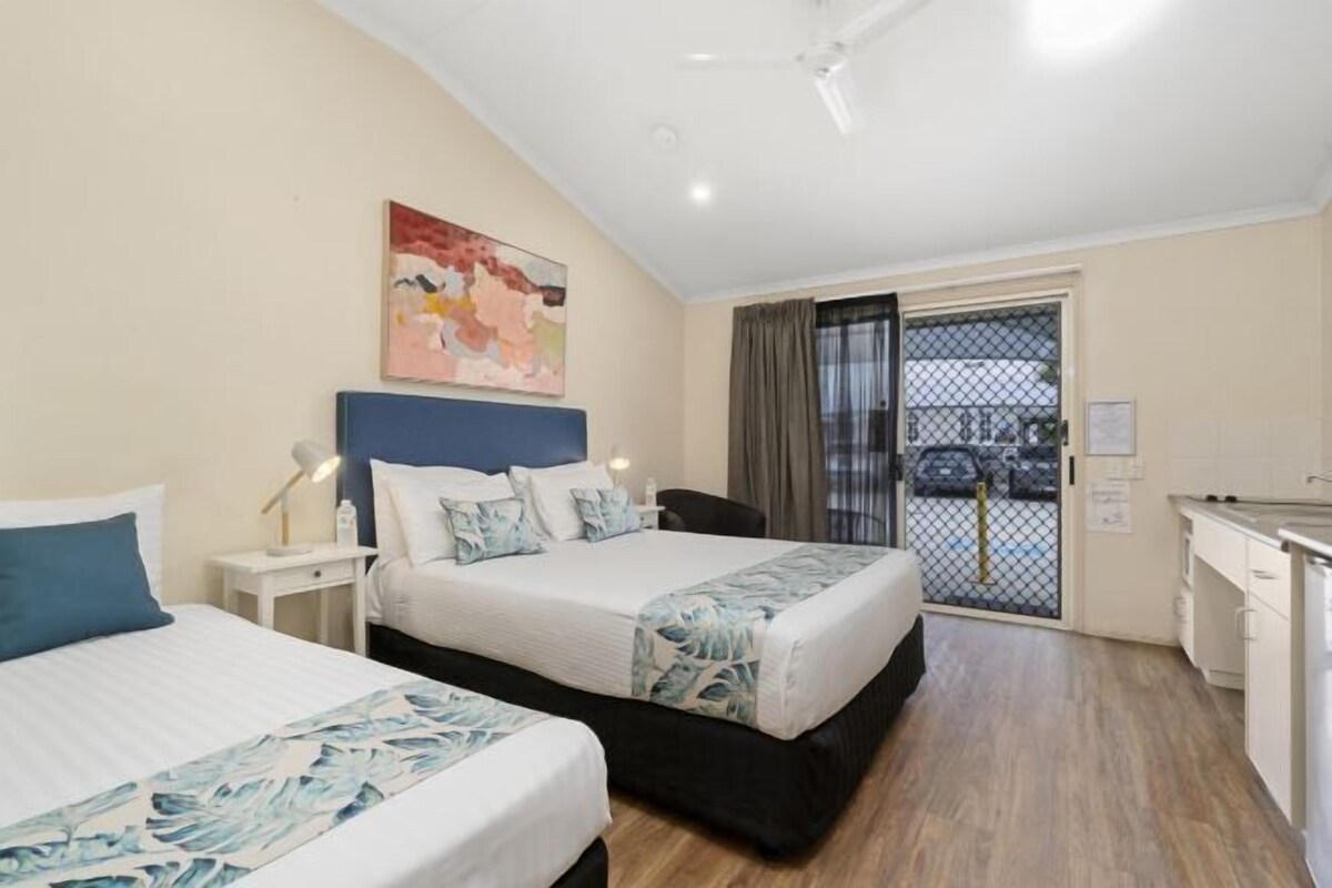 Premium bedding, pillow-top beds, laptop workspace, blackout curtains