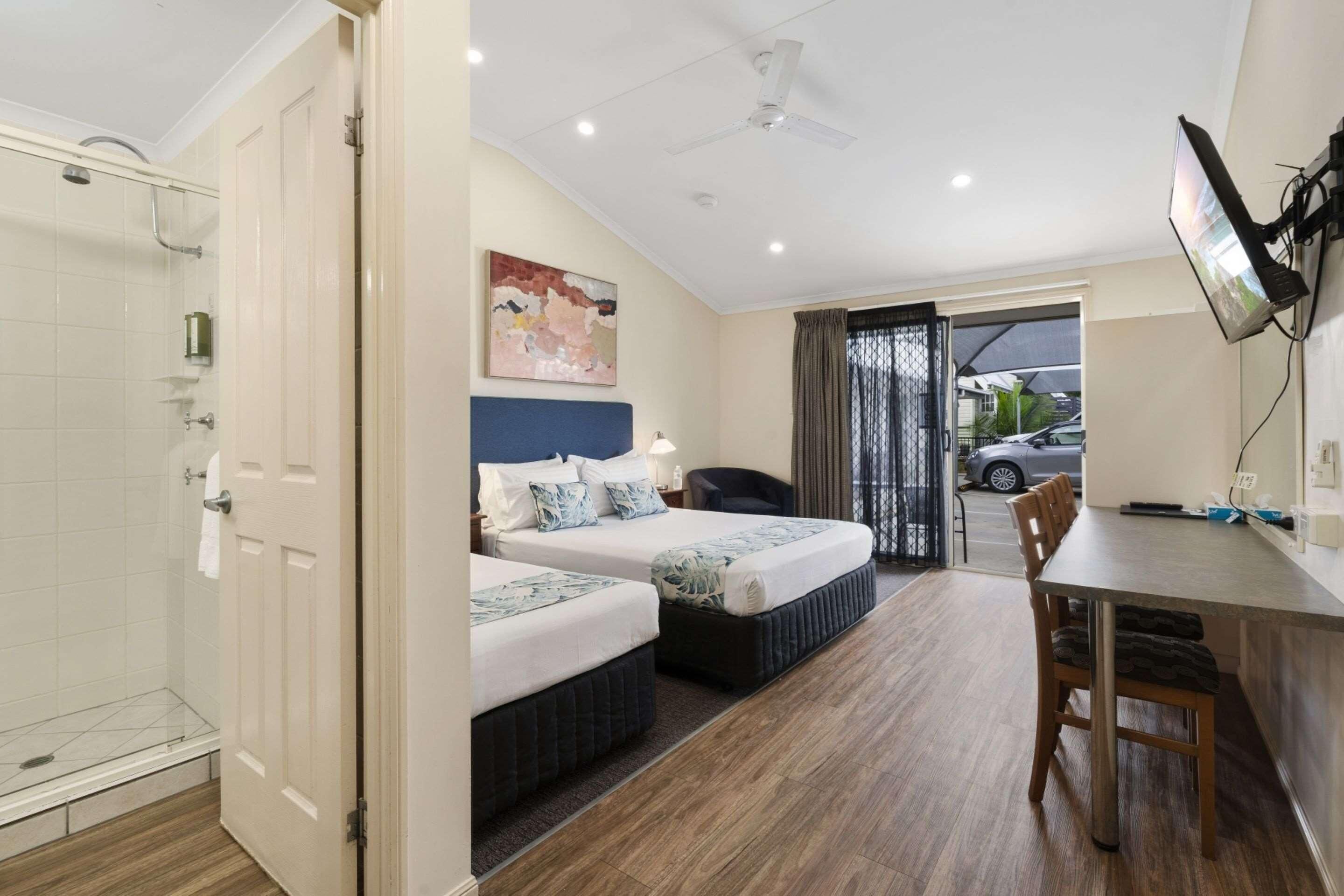 Premium bedding, pillow-top beds, laptop workspace, blackout curtains