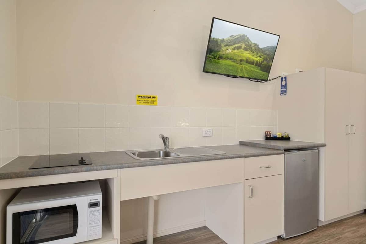 deluxe room, multiple beds, accessible, kitchenette | private kitchenette | fridge, microwave, stovetop, electric kettle