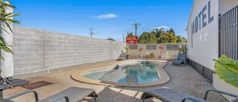 Outdoor pool, open 7:30 AM to 7:00 PM, free pool cabanas, pool umbrellas