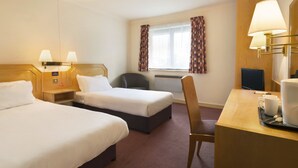A hotel room with two single beds, a desk with a chair, a coffee maker, and a television. - Days Inn by Wyndham Taunton (Taunton)