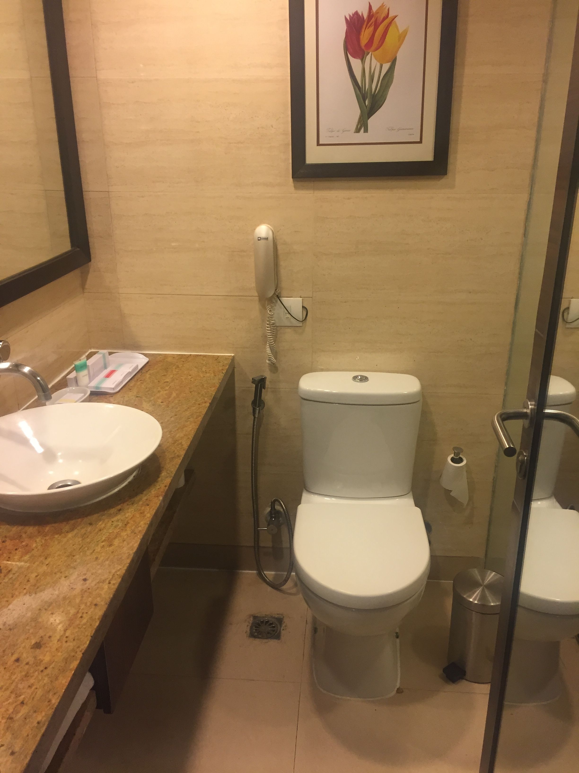 A bathroom with a sink, toilet, and shower.