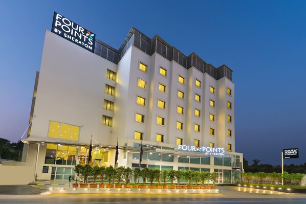 A multi-story hotel with a prominent sign reading "FOUR POINTS BY SHERATON". - Four Points by Sheraton Vadodara (Vadodara)