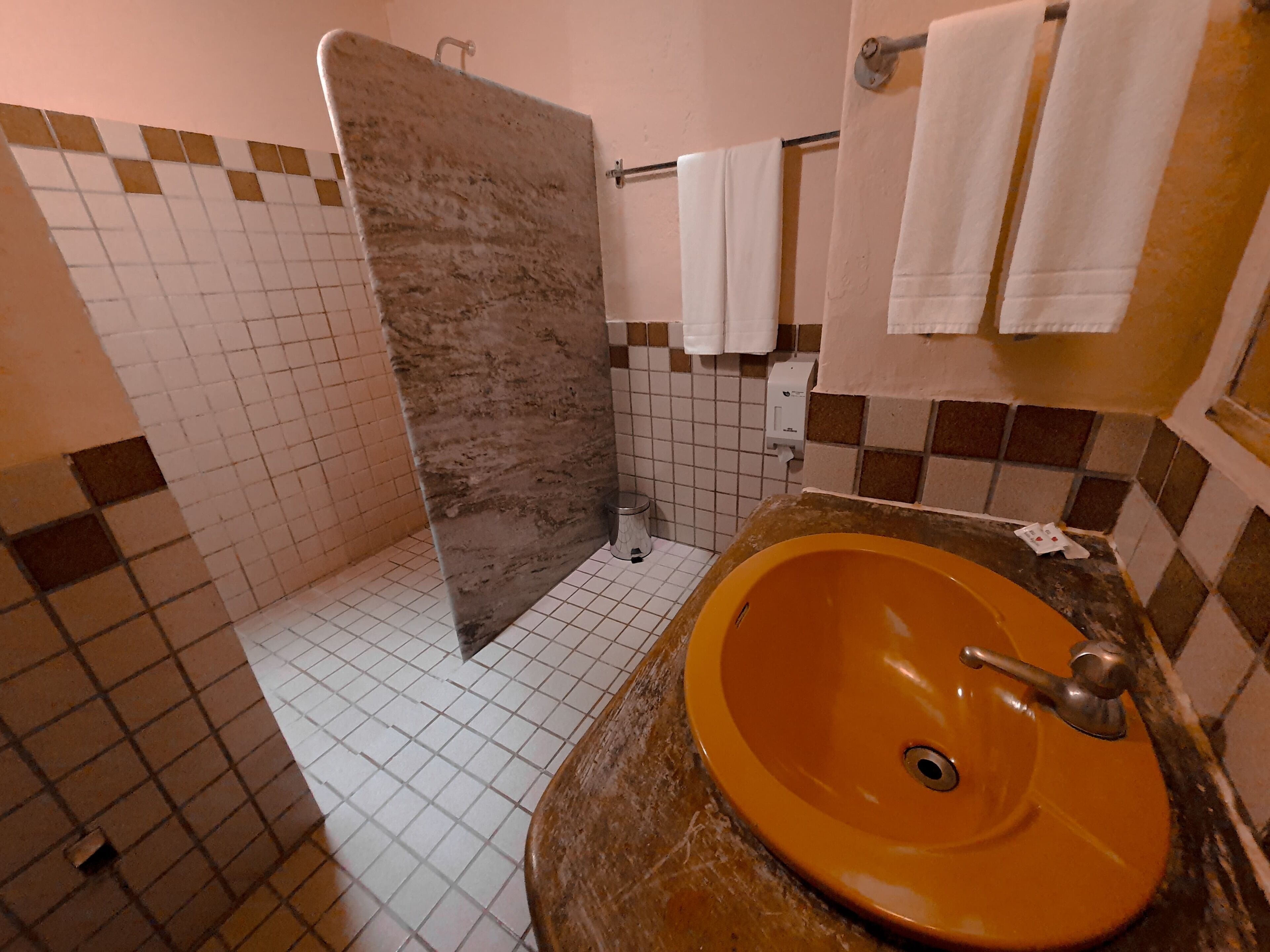 shower, hair dryer, towels, shampoo