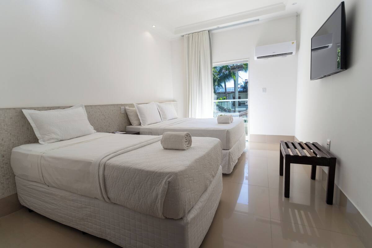 Premium Triple Room | Blackout drapes, WiFi (free), bed sheets