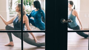 A yoga studio with a large glass door, allowing natural light to enter. - Four Seasons Residence Club Aviara, North San Diego (Carlsbad)