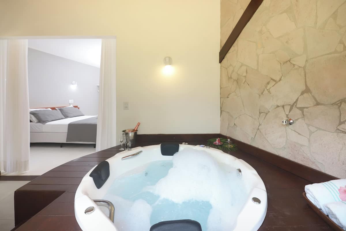 premium double room, 1 king bed, bathtub, garden view | view from room