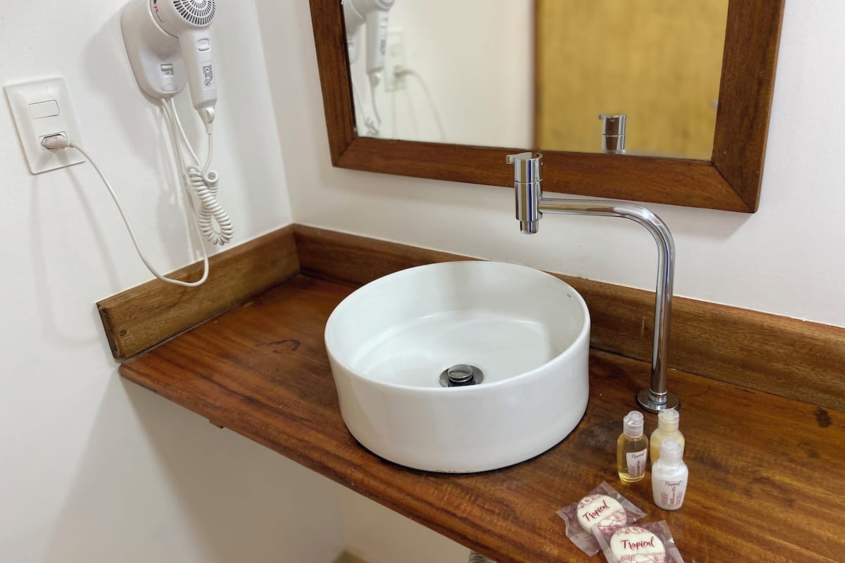 superior quadruple room | bathroom | shower, hair dryer, towels, soap