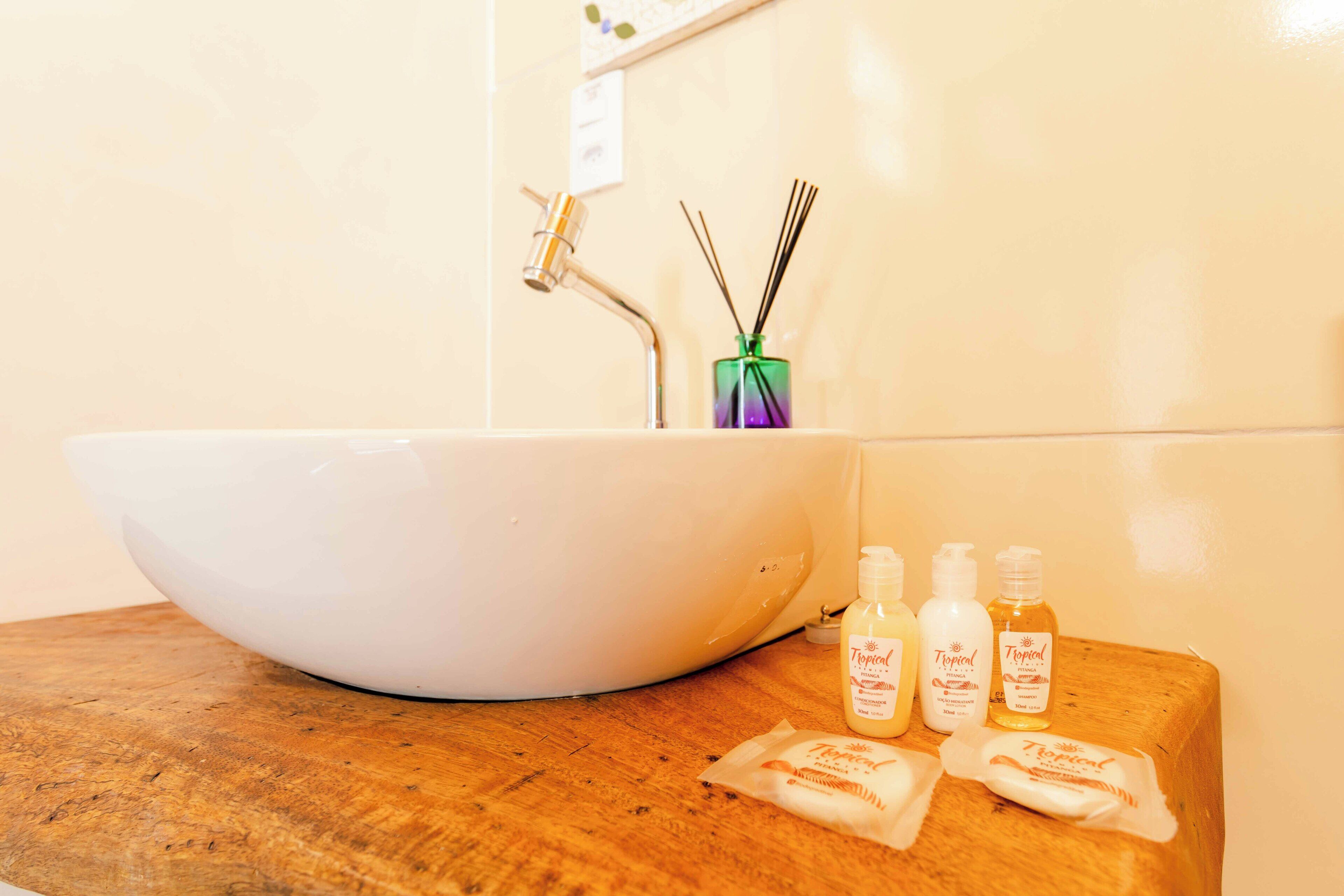 superior triple room | bathroom | shower, hair dryer, towels, soap