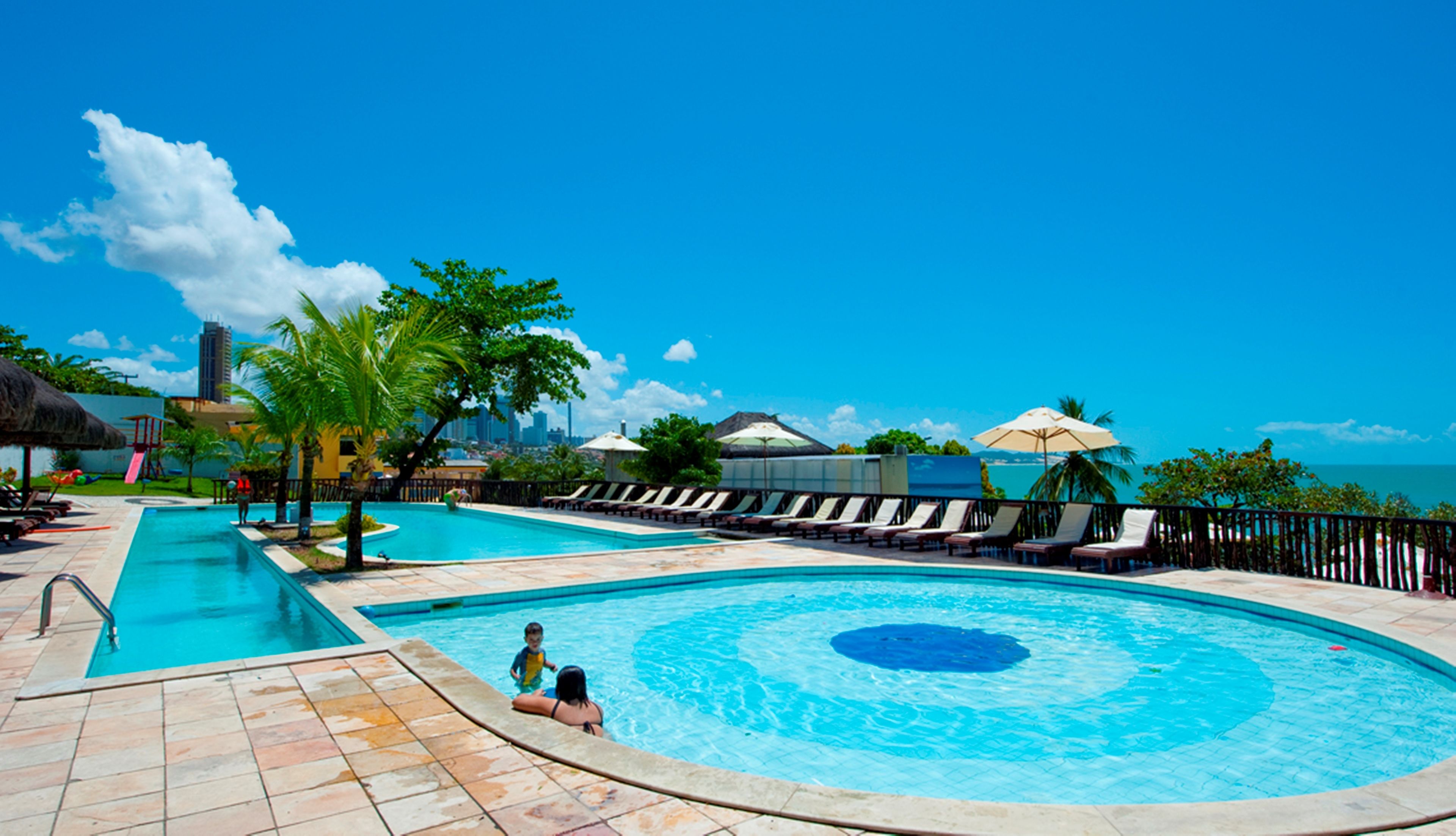 2 outdoor pools, pool umbrellas, pool loungers