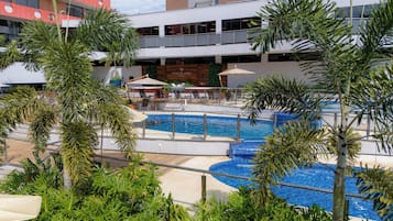 3 outdoor pools, open 10:00 AM to 10:00 PM, pool umbrellas