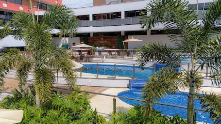 3 outdoor pools, open 10:00 AM to 10:00 PM, pool umbrellas, sun loungers