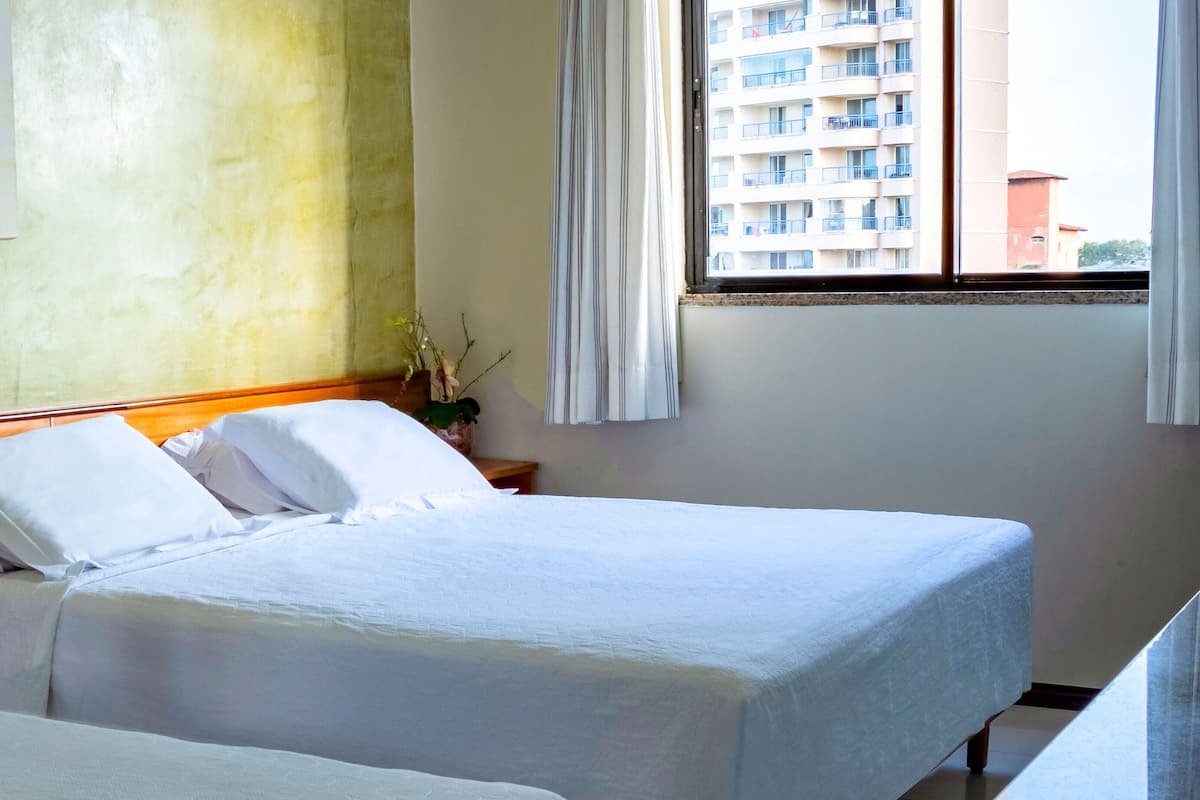 Single Room | Minibar, in-room safe, individually furnished, blackout drapes