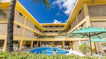 Indoor pool, outdoor pool, pool umbrellas, pool loungers