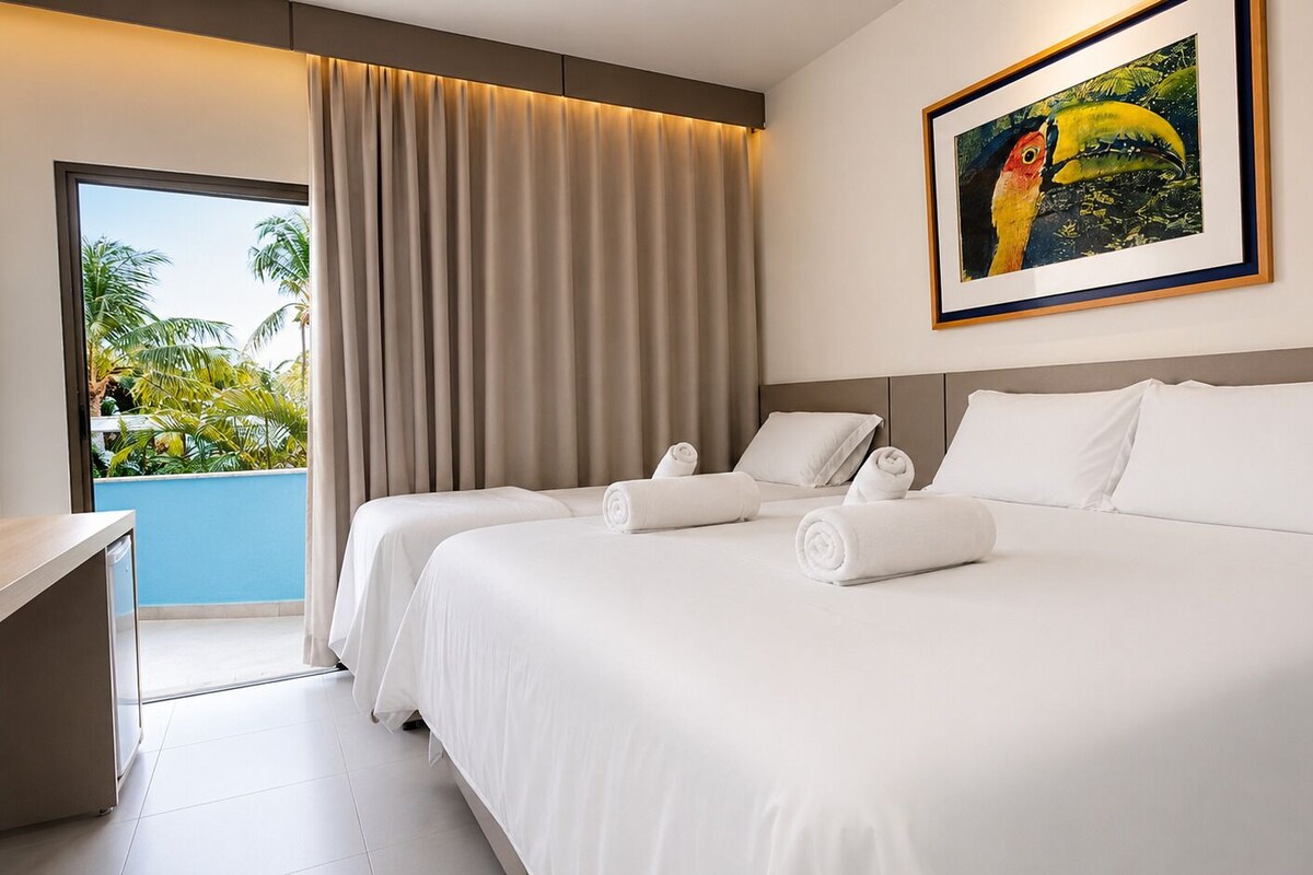 Superior Triple Room, Pool View | Minibar, in-room safe, laptop workspace, blackout drapes