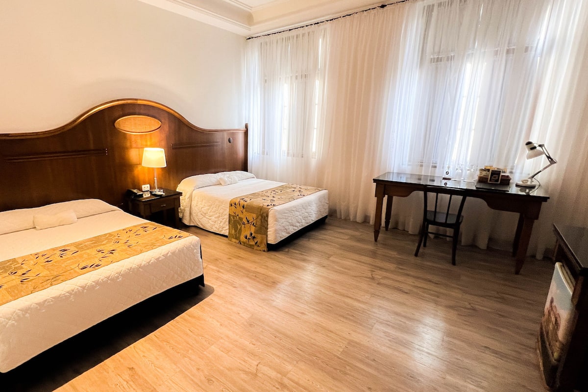 Deluxe Triple Room, 1 Double Bed | Minibar, in-room safe, individually decorated, individually furnished