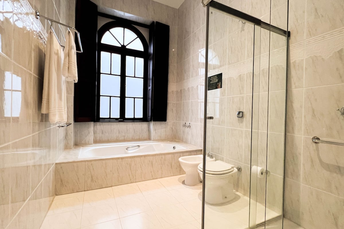 luxury suite, 1 king bed | bathroom | shower, free toiletries, hair dryer, towels