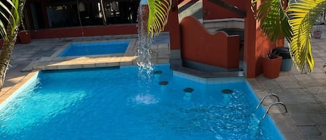 Indoor pool, outdoor pool, pool umbrellas, pool loungers