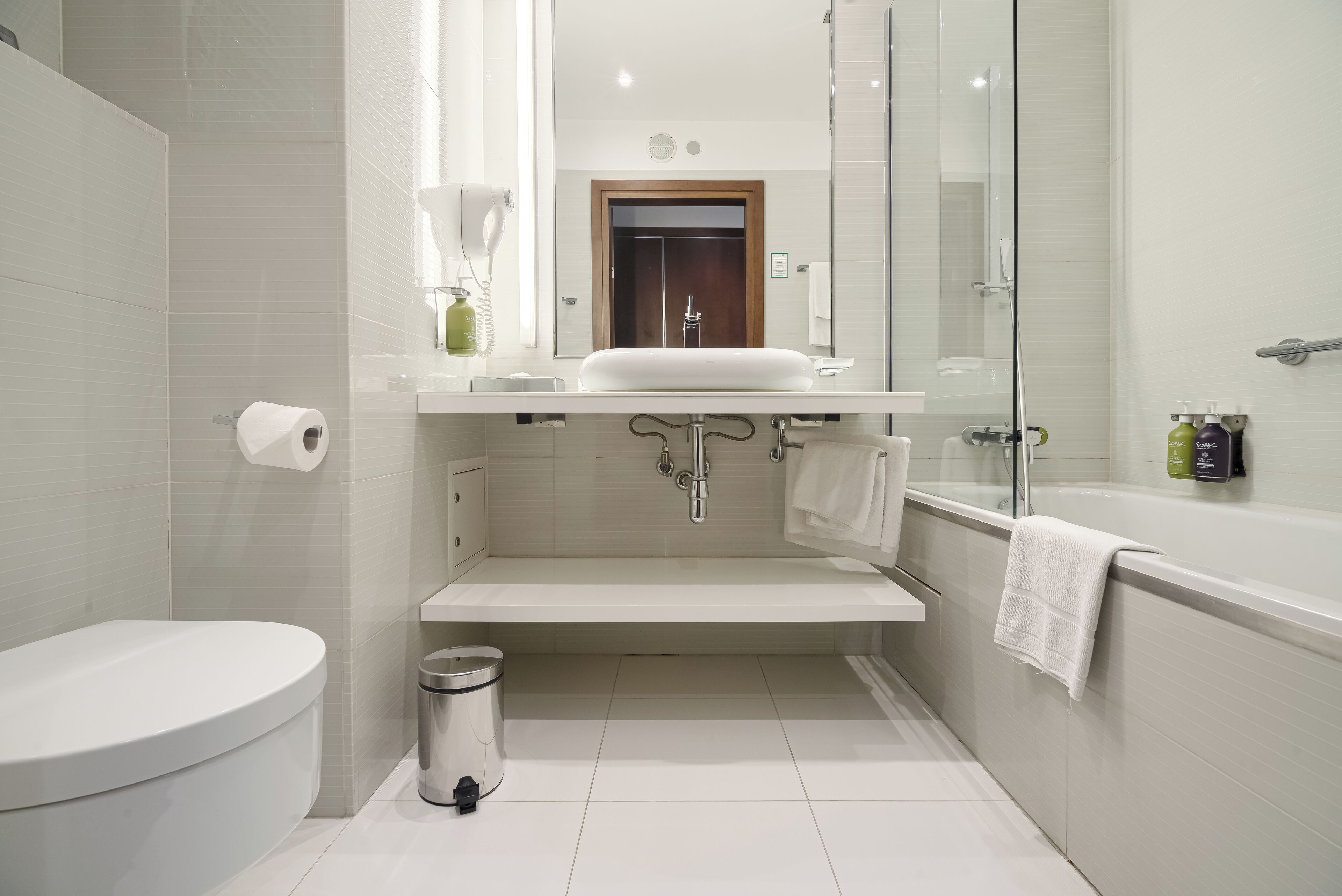 standard twin room | bathroom | rainfall showerhead, hair dryer, towels, soap