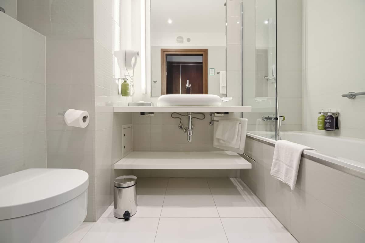 standard twin room | bathroom | rainfall showerhead, hair dryer, towels, soap