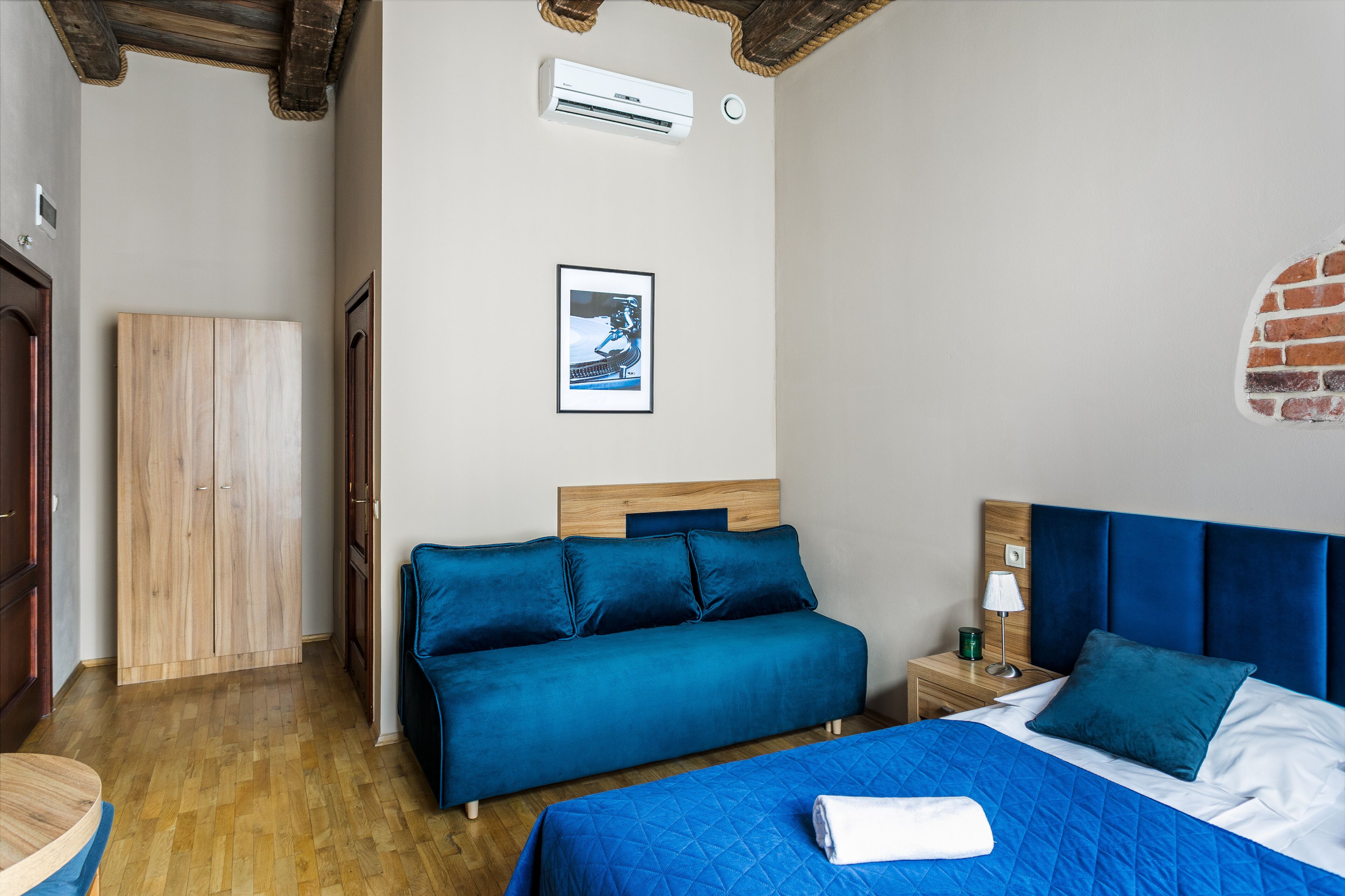 deluxe quadruple room | pillow-top beds, in-room safe, desk, blackout curtains