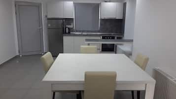 Family Apartment, 2 Bedrooms | Private kitchen | Fridge, cookware/dishes/utensils