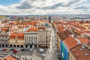 A historic cityscape with traditional architecture, a central square, and a river in the background. - Malostranska Residence (Prague)