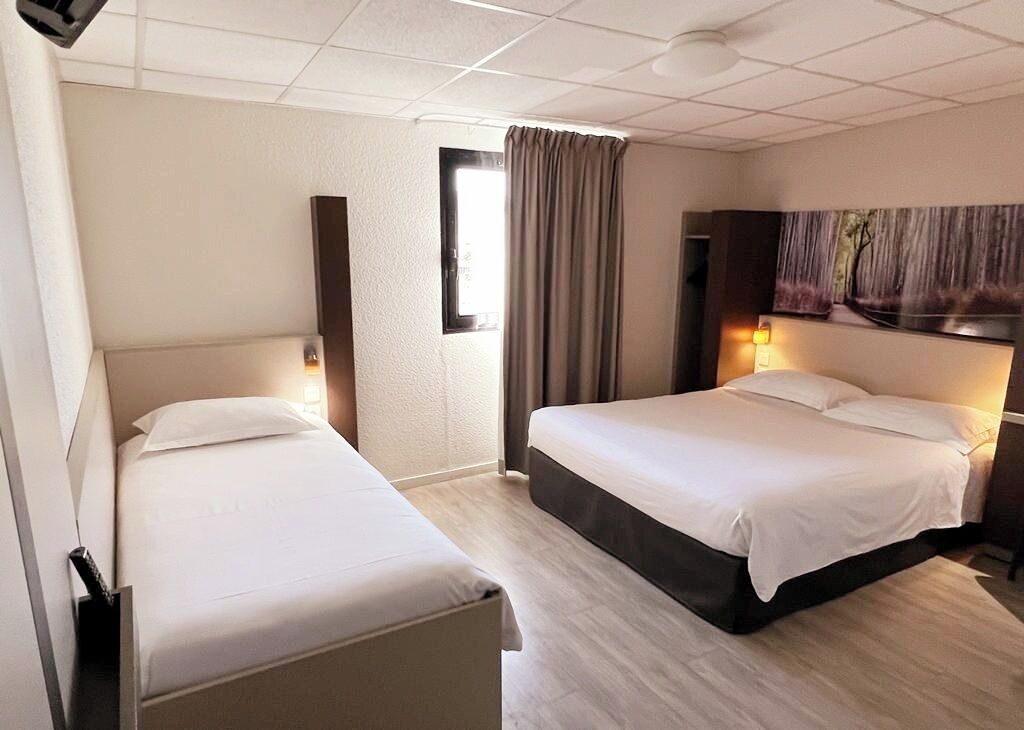 quadruple room | 1 bedroom, premium bedding, desk, blackout curtains