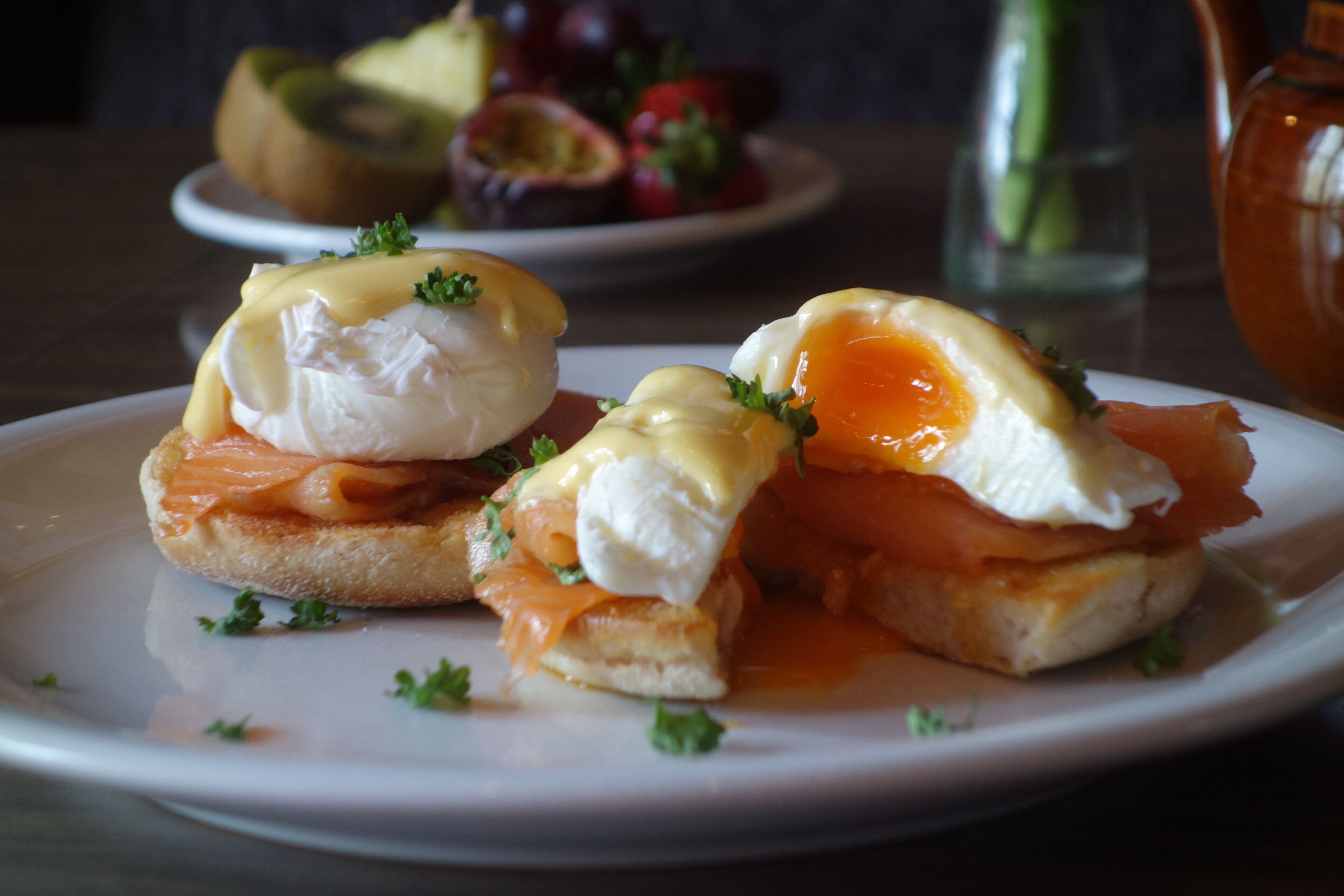 A plate with eggs benedict and smoked salmon.