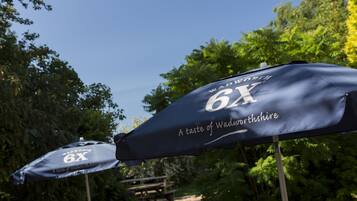 Two umbrellas with "WADWORTHSHIRE 6X" text, suggesting a location or event.
