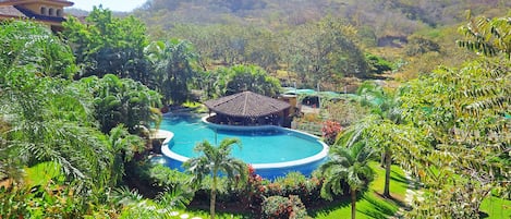 4 outdoor pools, open 8:00 AM to 10:00 PM, pool loungers