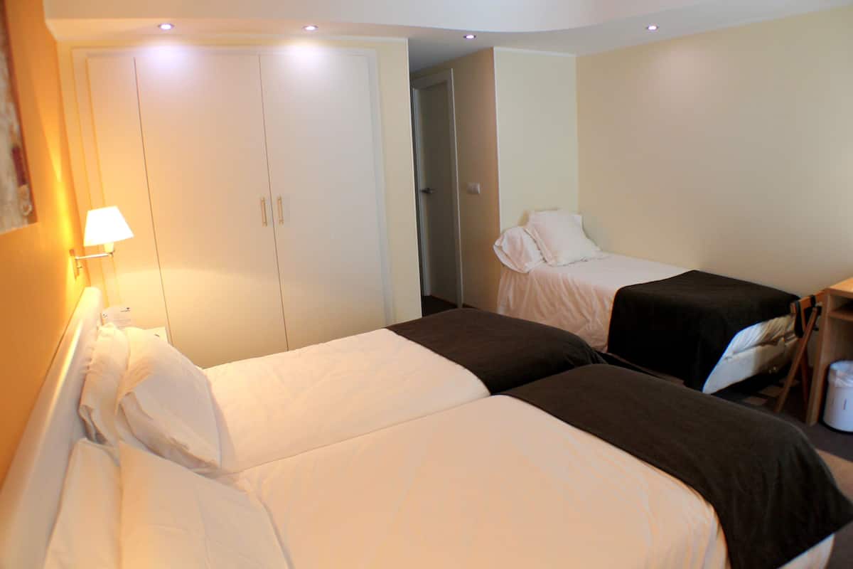 Triple Room Street View | 1 bedroom, premium bedding, down comforters, in-room safe