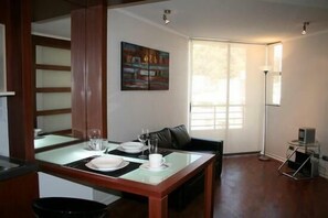 Basic Triple Room, 1 Bedroom | Living room - Santiago Suite Apartment (Santiago)