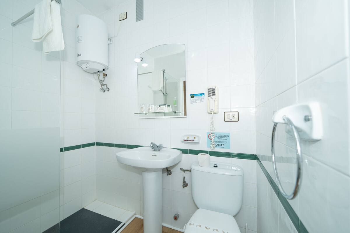 bathtub, free toiletries, hair dryer, slippers