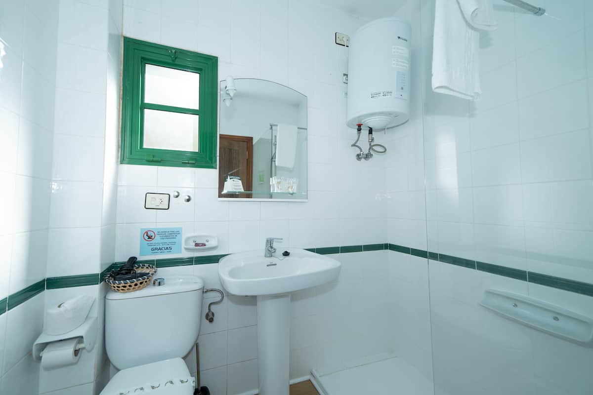 bathtub, free toiletries, hair dryer, slippers