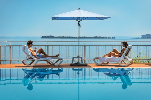 Seasonal outdoor pool, pool umbrellas, sun loungers
