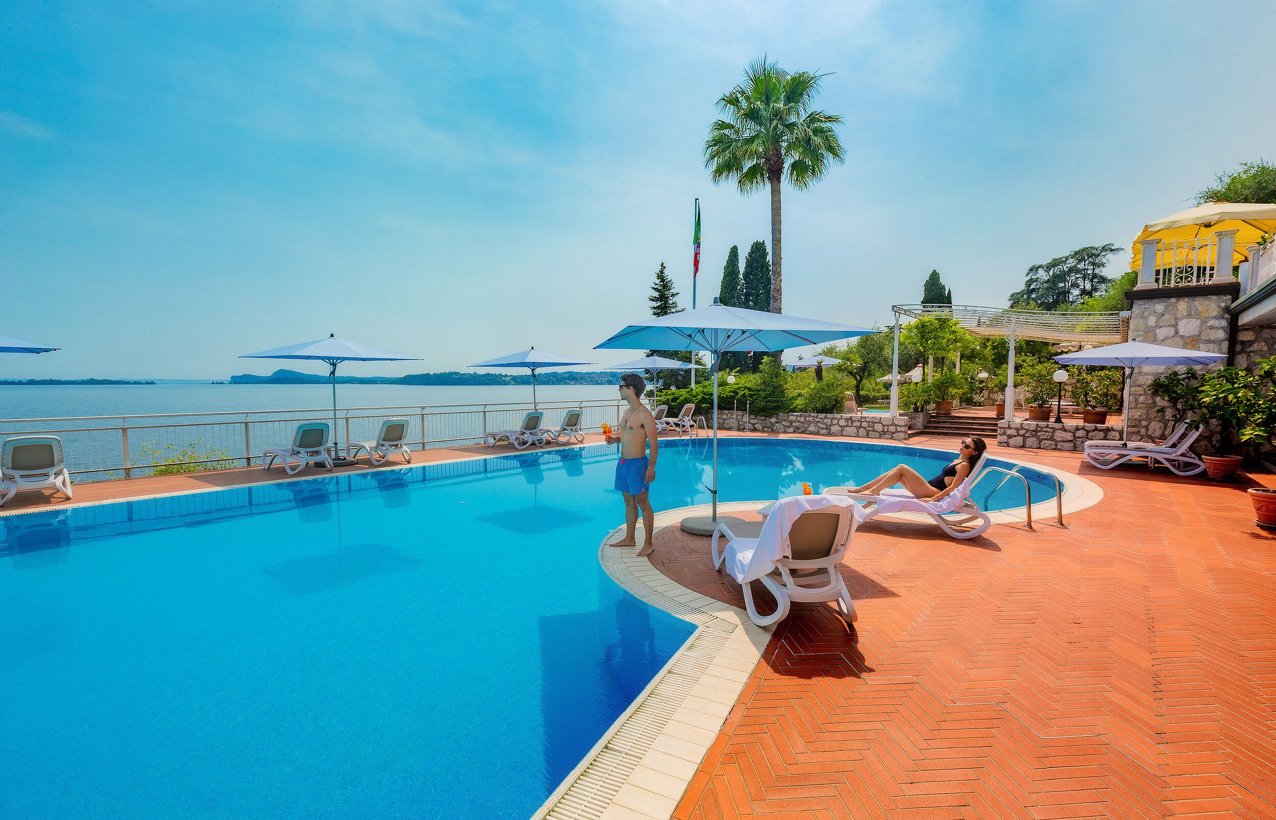 seasonal outdoor pool, pool umbrellas, pool loungers