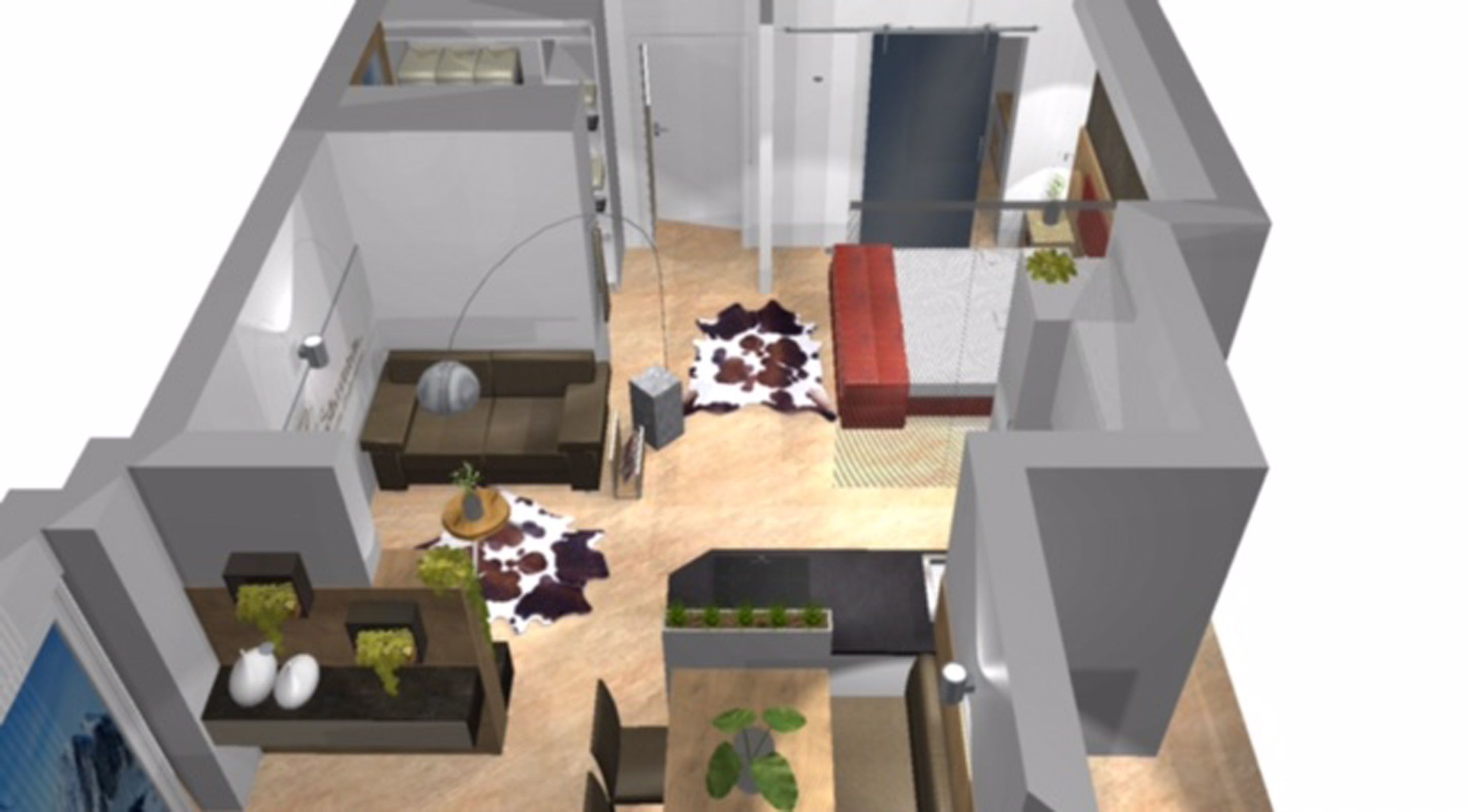 A modern interior with a sofa, a coffee table, a rug, and a small plant.